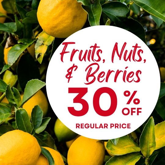 Yellow lemons growing on a tree with a circular sign that says "Fruits, Nuts, & Berries 30% off regular price" in red text.